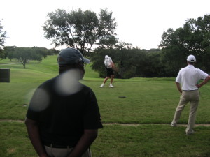 Cory Brown's shot to first playoff hole with Chester Burk(left) and Rick Arnett(Head Professional) looking on