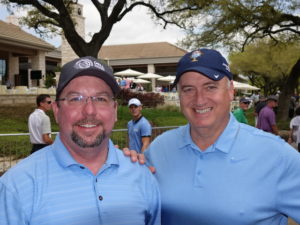 Randy Reynolds (right) and friend watching golf at the Dell Match Play